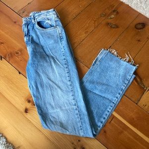 High waisted jeans with leg slit